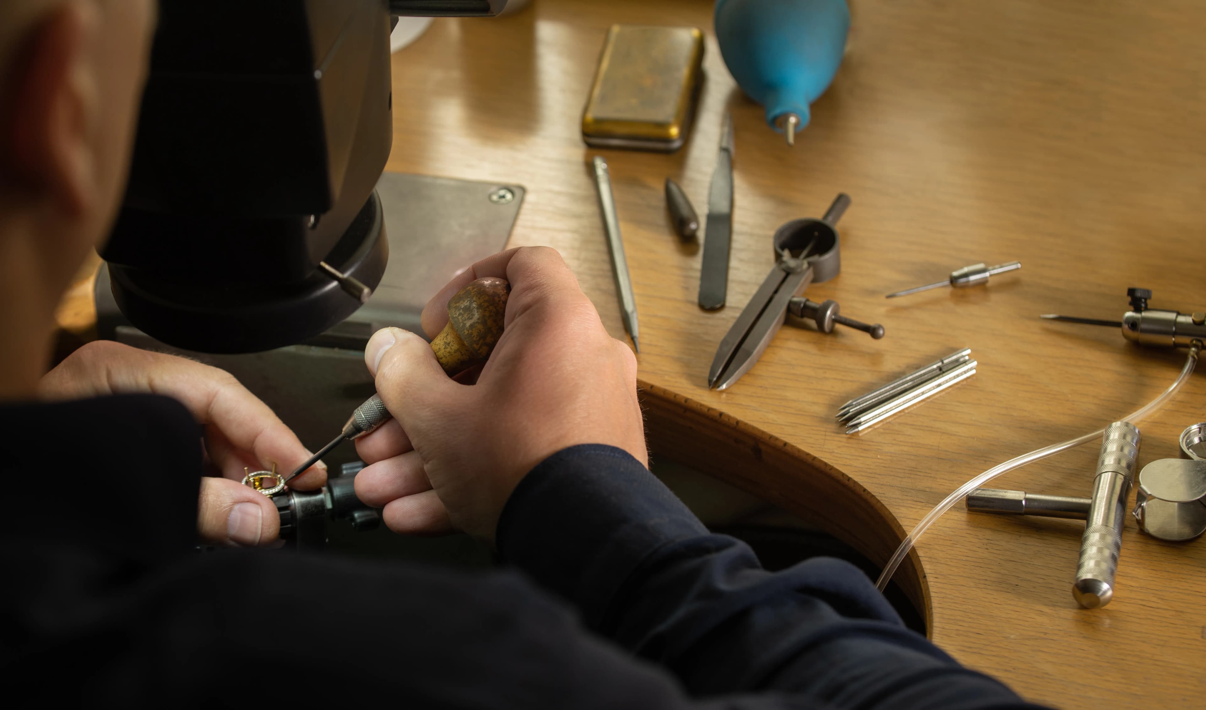 Goldsmith working on ring.